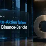 Krypto-Aktien fallen: Coinbase-Symbol aus Metall in einer dunklen Bürolobby als redaktionelle Illustration