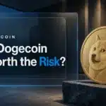 Gold Dogecoin sculpture on a slate plinth illustrating the question is Dogecoin a good investment in 2026