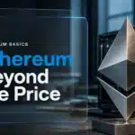 Metal Ethereum symbol beside computer hardware