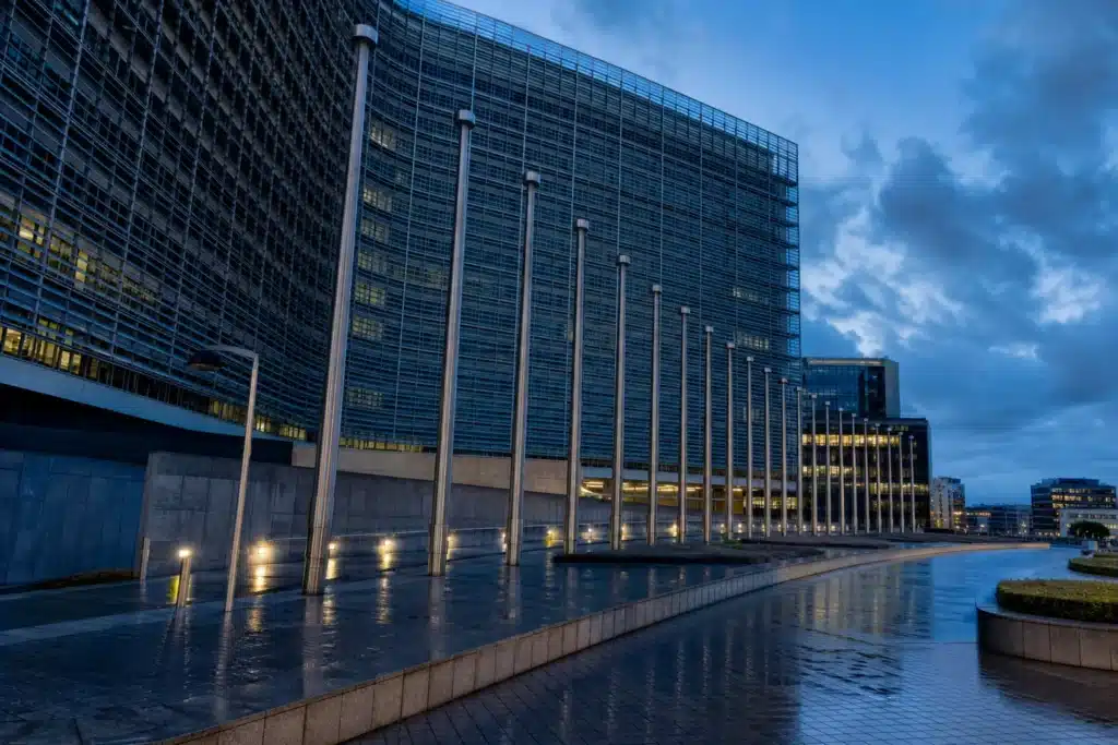 Glass government building at blue hour representing EU sanctions policy on Russia-linked crypto platforms